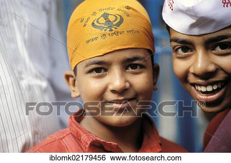 Young Sikh pilgrims near Hemkund wearing bandana with a Khanda symbol, religious symbol of the Sikhs and of Sikhism, Chamoli district, Uttarakhand, formerly Uttaranchal, Indian Himalayas, North India, India, Asia View Large Photo Image Stock Photograph - Young Sikh pilgrims near Hemkund wearing bandana with a Khanda symbol, religious symbol of the Sikhs and of Sikhism, Chamoli district, Uttarakhand, formerly Uttaranchal, Indian Himalayas, North India, India, Asia. Fotosearch
