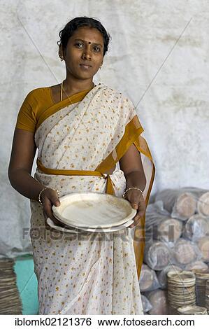 Young woman holding a plate made of palm leaves, small-scale industry, self-help initiative, Sevandhipalayam, near Karur, Tamil Nadu, India, Asia View Large Photo Image Stock Photograph - Young woman holding a plate made of palm leaves, small-scale industry, self-help initiative, Sevandhipalayam, near Karur, Tamil Nadu, India, Asia. Fotosearch