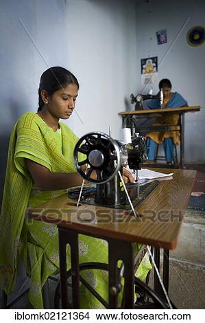 Picture - Young women are taught sewing and dressmaking under the supervision of a teacher, vocational and technical training, Nanniyur Pudhur near Karur, Tamil Nadu, India, Asia. Fotosearch