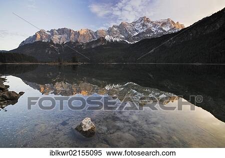 Zugspitze Mountain and the Wetterstein Range reflected in Lake Eibsee, Garmisch-Partenkirchen, Bavaria, Germany, Europe View Large Photo Image Stock Photography - Zugspitze Mountain and the Wetterstein Range reflected in Lake Eibsee, Garmisch-Partenkirchen, Bavaria, Germany, Europe. Fotosearch