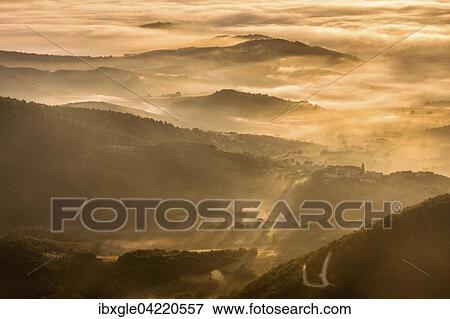 Aerial view, Mount Cucco, Monte Cucco in the Apennines at sunset, small village, Bastia, Marche and Umbria, Italy, Europe View Large Photo Image Stock Photo - Aerial view, Mount Cucco, Monte Cucco in the Apennines at sunset, small village, Bastia, Marche and Umbria, Italy, Europe. Fotosearch