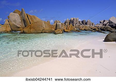 Stock Image - Anse Marron beach, also La Source Marron, with rocks, La Digue Island, Seychelles, Africa. Fotosearch