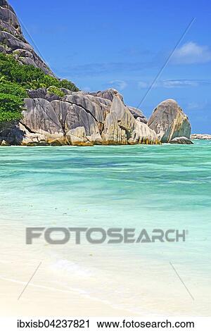 Stock Image - Beach and granite rocks at Anse La Reunion, La Digue, Seychelles, Africa. Fotosearch