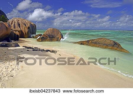 Stock Image - Beach and granite rocks on the beach, Source d`Argent, La Digue, Seychelles, Africa. Fotosearch