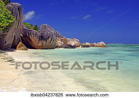 Stock Photograph - Beach and granite rocks on the beach, Source d`Argent, La Digue, Seychelles, Africa. Fotosearch