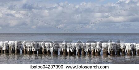 Breakwaters covered with snow and ice, Baltic Sea, Ruegen, Mecklenburg-Western Pomerania, Germany, Europe View Large Photo Image Stock Image - Breakwaters covered with snow and ice, Baltic Sea, Ruegen, Mecklenburg-Western Pomerania, Germany, Europe. Fotosearch