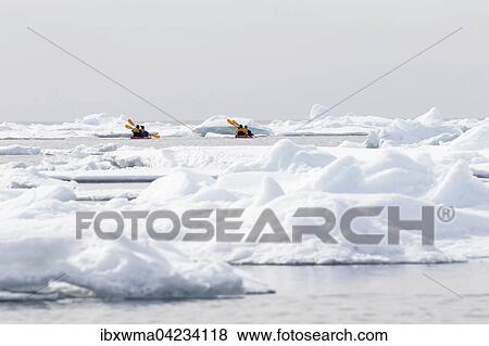 Canoeists amid icebergs on the sea ice edge of North Spitsbergen, Norway, Europe View Large Photo Image Stock Photo - Canoeists amid icebergs on the sea ice edge of North Spitsbergen, Norway, Europe. Fotosearch