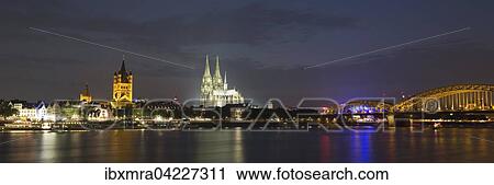 City Panorama at night, Cologne, Hohenzollern Bridge, Cathedral, Philharmonic Hall, Great St. Martin Church, Town Hall, historic centre, the Rhine, Cologne, North Rhine-Westphalia, Germany, Europe View Large Photo Image Stock Image - City Panorama at night, Cologne, Hohenzollern Bridge, Cathedral, Philharmonic Hall, Great St. Martin Church, Town Hall, historic centre, the Rhine, Cologne, North Rhine-Westphalia, Germany, Europe. Fotosearch