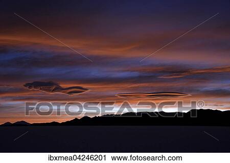 Stock Image - Colorful sunset at the salt lake Salar de Uyuni, Altiplano, Bolivia, South America. Fotosearch