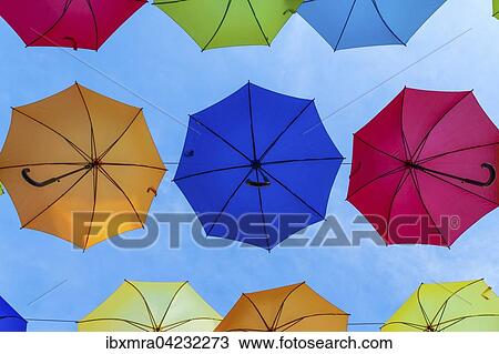 Colourful umbrellas side by side against blue sky, Novigrad, Istria, Croatia, Europe View Large Photo Image Stock Image - Colourful umbrellas side by side against blue sky, Novigrad, Istria, Croatia, Europe. Fotosearch