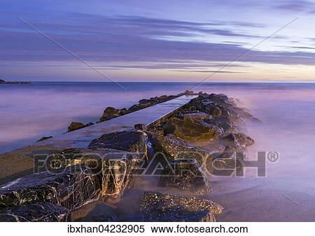 Concrete pier, at dusk, Levanto, Liguria, Italy, Europe View Large Photo Image Stock Photography - Concrete pier, at dusk, Levanto, Liguria, Italy, Europe. Fotosearch