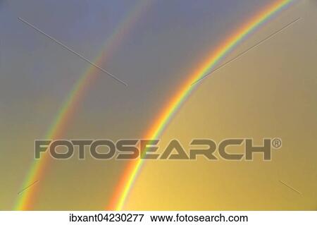 Stock Photo - Double rainbow in the evening sky, rainbow segment, North Rhine-Westphalia, Germany, Europe. Fotosearch