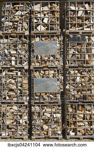 Picture - Firewood, one stere in pallet cages. Fotosearch