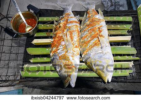 Fish, Creole style snapper on charcoal grill, La Digue Island, Seychelles, Africa View Large Photo Image Stock Photo - Fish, Creole style snapper on charcoal grill, La Digue Island, Seychelles, Africa. Fotosearch