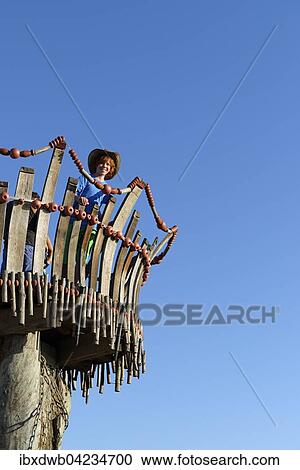 Girl standing on lookout tower at Cape Kamenjak, National Park in Premantura, Istria, Croatia, Europe View Large Photo Image Stock Image - Girl standing on lookout tower at Cape Kamenjak, National Park in Premantura, Istria, Croatia, Europe. Fotosearch