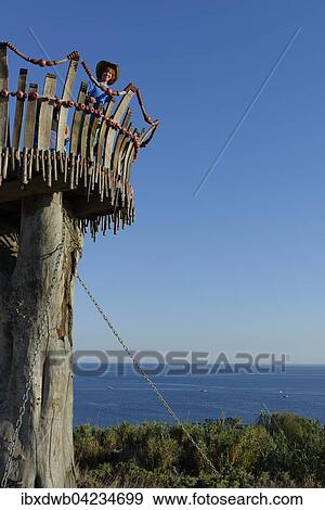 Girl standing on lookout tower at Cape Kamenjak, National Park in Premantura, Istria, Croatia, Europe View Large Photo Image Stock Photo - Girl standing on lookout tower at Cape Kamenjak, National Park in Premantura, Istria, Croatia, Europe. Fotosearch