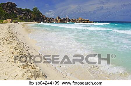Grand Anse, dreamlike beach with rocks and palm trees, La Digue Island, Seychelles, Africa View Large Photo Image Stock Photo - Grand Anse, dreamlike beach with rocks and palm trees, La Digue Island, Seychelles, Africa. Fotosearch