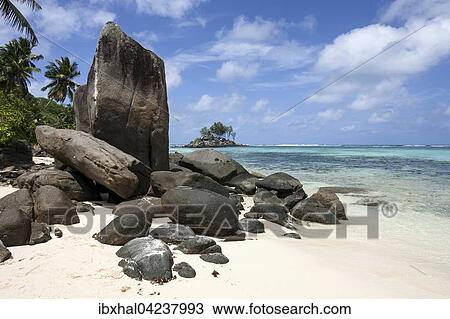 Granite rocks on beach, turquoise sea at Anse Royal, Mahe Island, Seychelles, Africa View Large Photo Image Stock Image - Granite rocks on beach, turquoise sea at Anse Royal, Mahe Island, Seychelles, Africa. Fotosearch