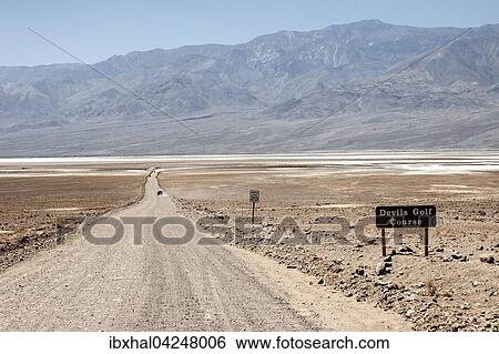 Gravel road to Devil's Golf Course, Panamint Range behind, Black Mountains, Death Valley National Park, Mojave Desert, California, USA, North America View Large Photo Image Stock Photograph - Gravel road to Devil's Golf Course, Panamint Range behind, Black Mountains, Death Valley National Park, Mojave Desert, California, USA, North America. Fotosearch