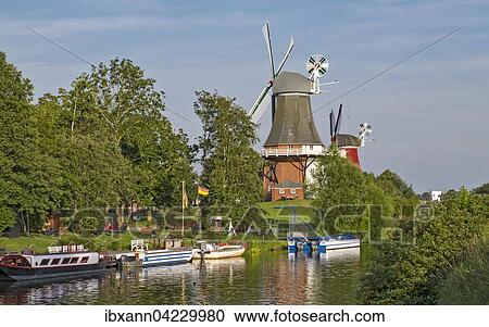 Stock Image - Greetsiel twin mills, Greetsiel, Krummhorn, East Frisia, Lower Saxony, Germany, Europe. Fotosearch