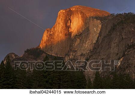 Half Dome illuminated by setting sun, evening light, stormy mood, Yosemite National Park, USA, North America View Large Photo Image Stock Photography - Half Dome illuminated by setting sun, evening light, stormy mood, Yosemite National Park, USA, North America. Fotosearch