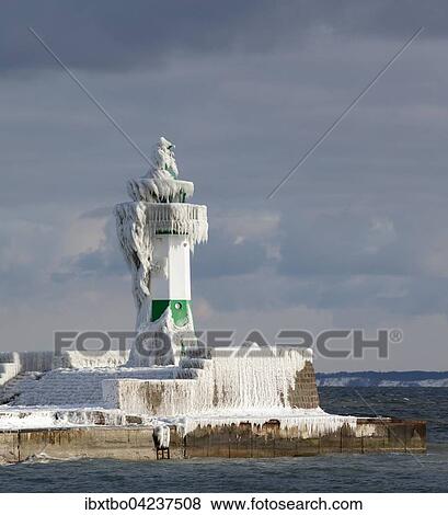 Icy lighthouse in harbour, Baltic Sea, Sassnitz, Rugen, Mecklenburg-Western Pomerania, Germany, Europe View Large Photo Image Stock Photo - Icy lighthouse in harbour, Baltic Sea, Sassnitz, Rugen, Mecklenburg-Western Pomerania, Germany, Europe. Fotosearch
