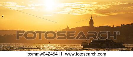 Stock Image - Lighthouse, Maiden's Tower, Kiz Kulesi, at sunset, island in the Bosporus, Uskudar, Istanbul Turkey. Fotosearch