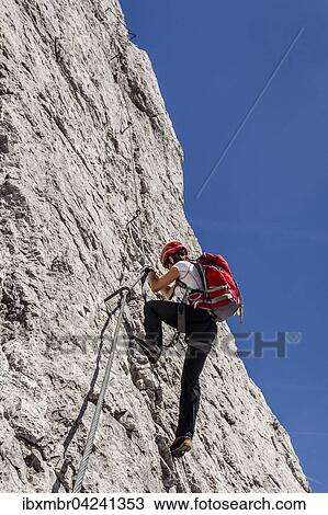 Stock Image - Mountaineer on via ferrata, climbing to Maldonkopf, Lechtal Alps, Hochimst, Imst, Tyrol, Austria, Europe. Fotosearch