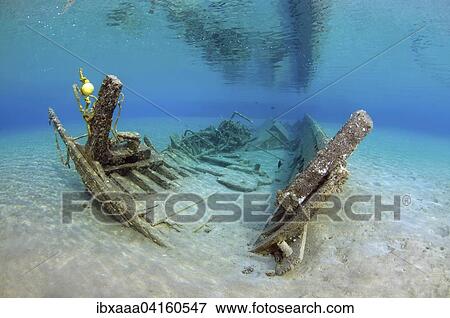 Old shipwrecked fishing boat on sandy seabed, Red Sea, Marsa Alam, Egypt, Africa View Large Photo Image Stock Photo - Old shipwrecked fishing boat on sandy seabed, Red Sea, Marsa Alam, Egypt, Africa. Fotosearch