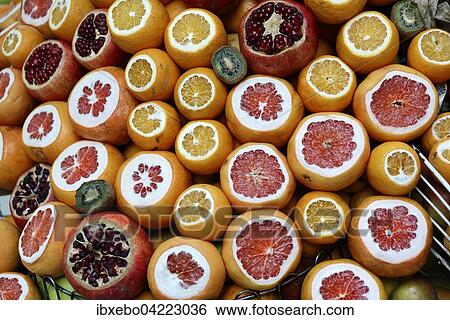 Oranges, grapefruit and pomegranate, cut open, at a market stall, Istanbul, Turkey, Asia View Large Photo Image Stock Photograph - Oranges, grapefruit and pomegranate, cut open, at a market stall, Istanbul, Turkey, Asia. Fotosearch