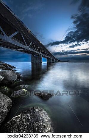 Stock Photo - Oresund Bridge, Oresundsbroen, world's longest cable-stayed bridge connecting Copenhagen with Malmo, Denmark, Sweden, Europe. Fotosearch