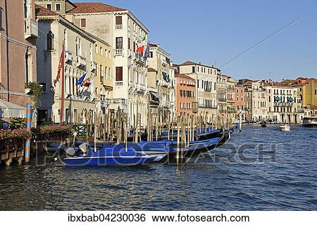 Palaces and covered gondolas on Grand Canal, Venice, Venezia, Veneto, Italy, Europe View Large Photo Image Stock Photograph - Palaces and covered gondolas on Grand Canal, Venice, Venezia, Veneto, Italy, Europe. Fotosearch