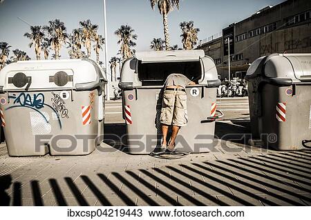 Person looking into a garbage can, unemployment, Barcelona, Spain, Europe View Large Photo Image Stock Image - Person looking into a garbage can, unemployment, Barcelona, Spain, Europe. Fotosearch
