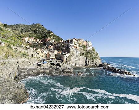 Rocky coast and view to the village of Manarola, Cinque Terre, Manarola, Liguria, Italy, Europe View Large Photo Image Stock Photo - Rocky coast and view to the village of Manarola, Cinque Terre, Manarola, Liguria, Italy, Europe. Fotosearch