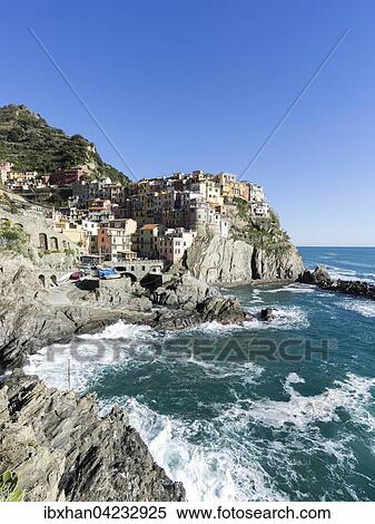 Rocky coast and view to the village of Manarola, Cinque Terre, Manarola, Liguria, Italy, Europe View Large Photo Image Stock Photography - Rocky coast and view to the village of Manarola, Cinque Terre, Manarola, Liguria, Italy, Europe. Fotosearch