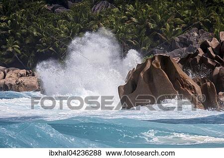 Strong surf, churning sea, granite rocks, palm trees behind, Grand Anse, La Digue Island, Indian Ocean, Seychelles, Africa View Large Photo Image Stock Photo - Strong surf, churning sea, granite rocks, palm trees behind, Grand Anse, La Digue Island, Indian Ocean, Seychelles, Africa. Fotosearch