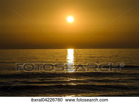 Stock Image - Sunset, beach, Mediterranean Sea, Tuscany, Italy, Europe. Fotosearch