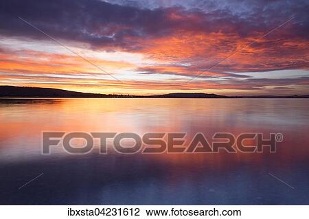 Stock Image - Sunset over Lake Constance, view from Hegne, evening light, Baden-Wurttemberg, Germany, Europe. Fotosearch