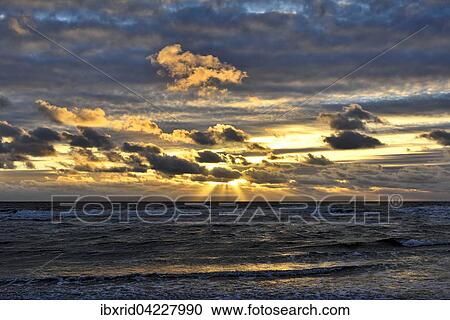 Sunset with clouds on the beach, North Sea, Texel, West Frisian Islands, Province of North Holland, The Netherlands, Europe View Large Photo Image Stock Image - Sunset with clouds on the beach, North Sea, Texel, West Frisian Islands, Province of North Holland, The Netherlands, Europe. Fotosearch