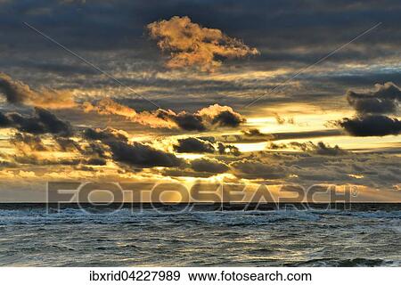 Sunset with clouds on the beach, North Sea, Texel, West Frisian Islands, Province of North Holland, The Netherlands, Europe View Large Photo Image Stock Photo - Sunset with clouds on the beach, North Sea, Texel, West Frisian Islands, Province of North Holland, The Netherlands, Europe. Fotosearch