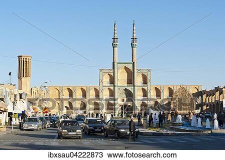 Stock Image - Tekiyeh Amir Chaqmaq Square and former mosque with twin minarets, Yazd, Iran, Asia. Fotosearch