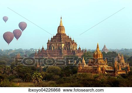 Thabeik Hmauk with hot air balloons, at sunset, one of Bagan's 4000 temples, Bagan, Myanmar, Asia View Large Photo Image Stock Photo - Thabeik Hmauk with hot air balloons, at sunset, one of Bagan's 4000 temples, Bagan, Myanmar, Asia. Fotosearch