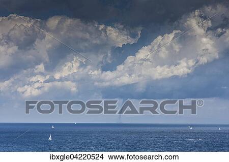 Tornado, waterspout near sailboats, overlooking the Tyrrhenian Sea, from the coast of Elba Island, Livorno province, Tuscana, Italy, Europe View Large Photo Image Picture - Tornado, waterspout near sailboats, overlooking the Tyrrhenian Sea, from the coast of Elba Island, Livorno province, Tuscana, Italy, Europe. Fotosearch