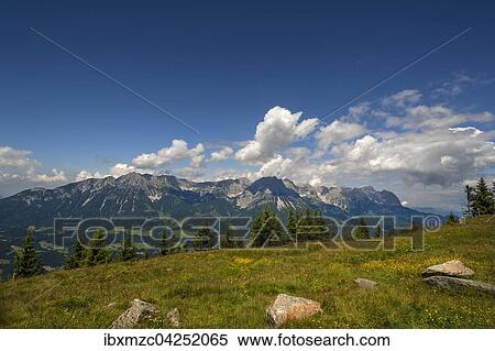 Stock Photography - View from Brandstadl towards Wilder Kaiser, cloudy sky, Scheffau am Wilden Kaiser, Tyrol, Austria, Europe. Fotosearch