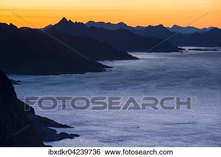 View from Reinebringen, Reinebriggen, 442m, midnight sun, on the island chains of mountains, Moskenes, Moskenesoy, Lofoten, Norway, Europe View Large Photo Image Stock Photograph - View from Reinebringen, Reinebriggen, 442m, midnight sun, on the island chains of mountains, Moskenes, Moskenesoy, Lofoten, Norway, Europe. Fotosearch