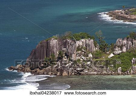 View of coast with granite rocks and sea at Port Glaud, Mahe Island, Seychelles, Africa View Large Photo Image Stock Photo - View of coast with granite rocks and sea at Port Glaud, Mahe Island, Seychelles, Africa. Fotosearch