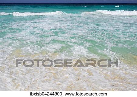 Stock Image - Waves and spray on Grand Anse beach, La Digue Island, Seychelles, Africa. Fotosearch