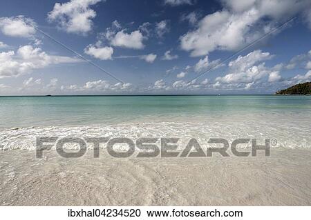 White sandy beach Anse Volbert, turquoise water, blue sky with clouds, Indian Ocean, Praslin Island, Seychelles, Africa View Large Photo Image Stock Image - White sandy beach Anse Volbert, turquoise water, blue sky with clouds, Indian Ocean, Praslin Island, Seychelles, Africa. Fotosearch
