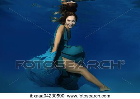 Woman in a long white dress under water, underwater fashion in the pool, Odessa, Ukraine, Europe View Large Photo Image Stock Image - Woman in a long white dress under water, underwater fashion in the pool, Odessa, Ukraine, Europe. Fotosearch