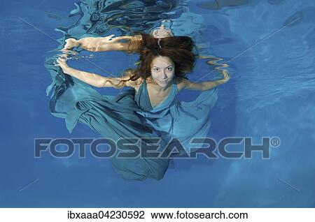 Woman in a long white dress under water, underwater fashion in the pool, Odessa, Ukraine, Europe View Large Photo Image Stock Image - Woman in a long white dress under water, underwater fashion in the pool, Odessa, Ukraine, Europe. Fotosearch